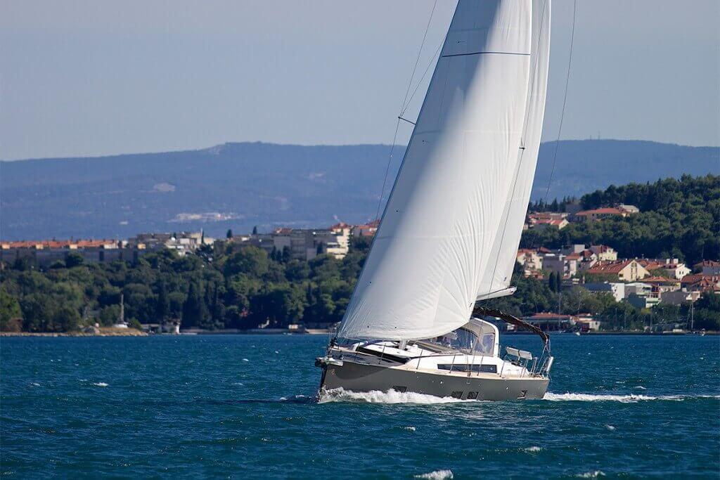 yacht in front of an island town