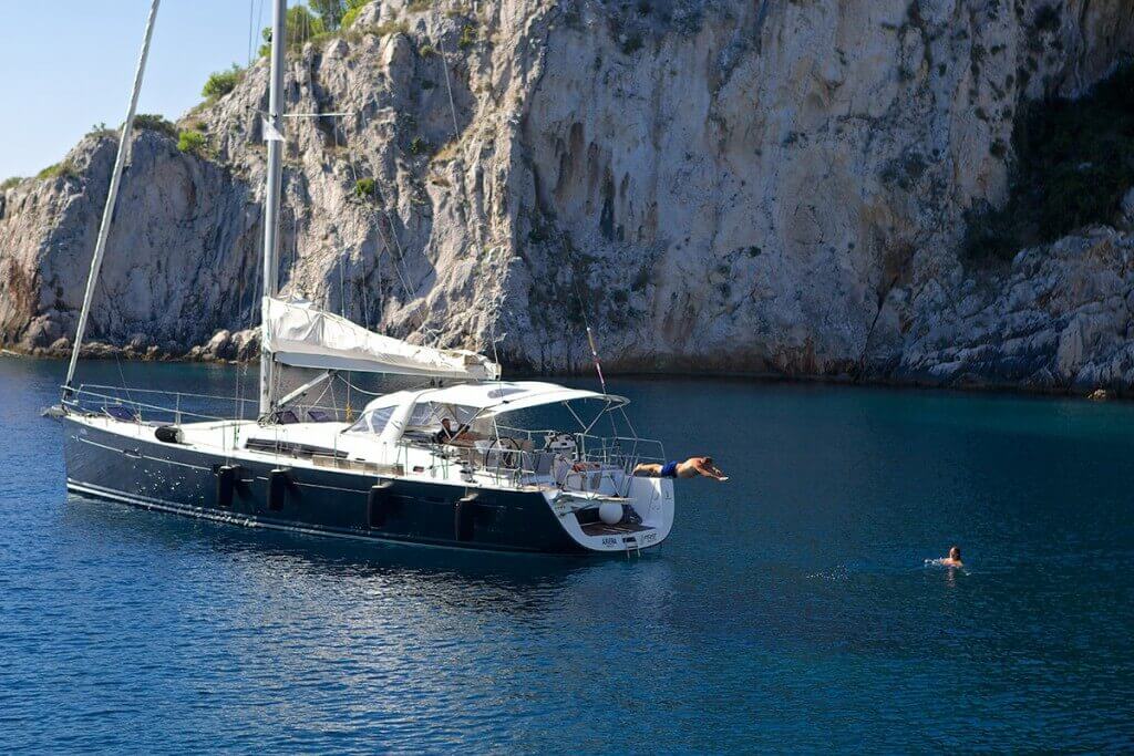 jumping into the water from yacht