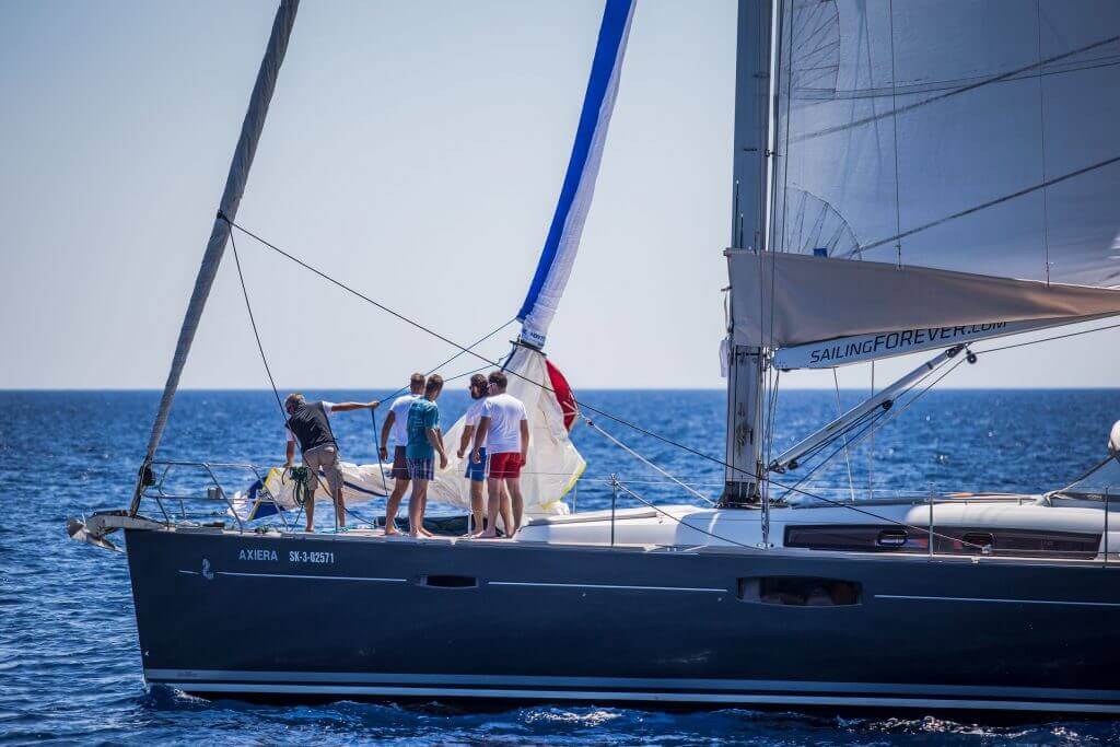 people in the front part of a yacht