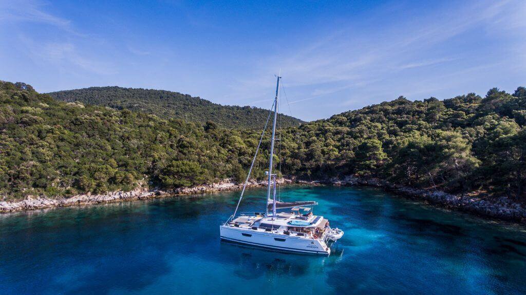 yacht parked near a coastline