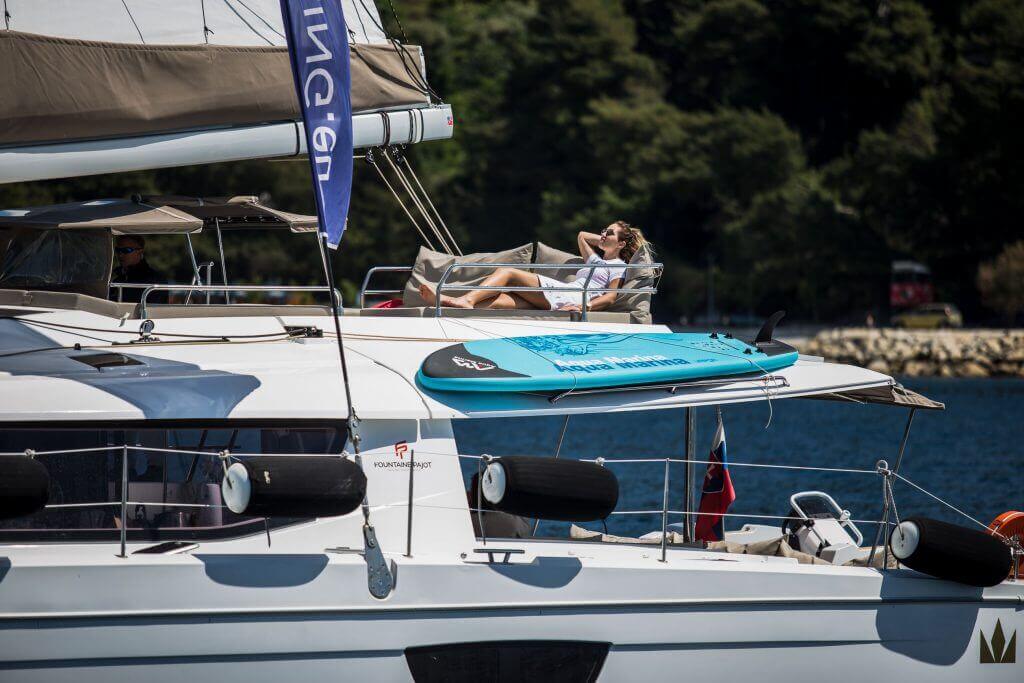 hostess laying on a yacht